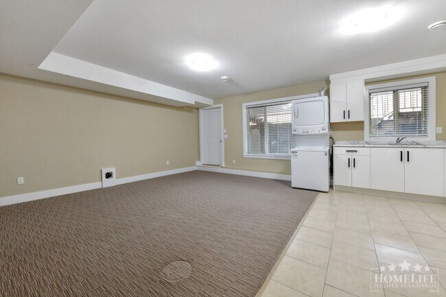 Photo du bâtiment - Bright & Spacious 2 Bed / 1 Bath Basement Suite in Clayton Heights – Perfect for Small Families