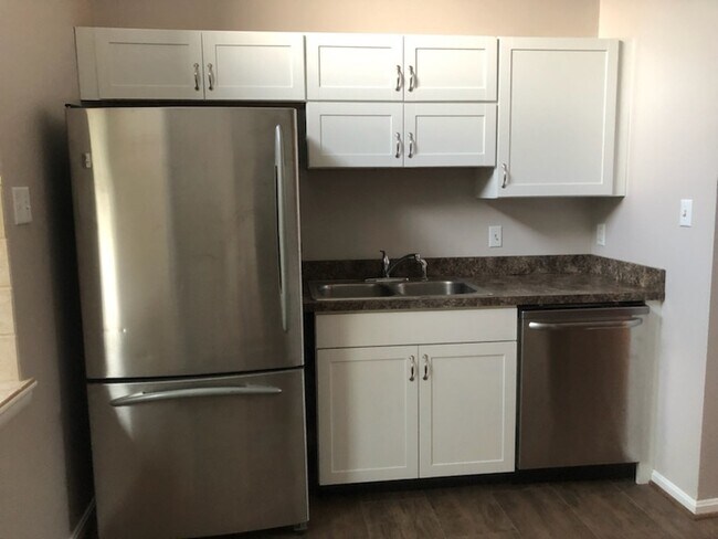 Kitchen: refrigerator, sink and dishwasher - 10803 N Glade Ct