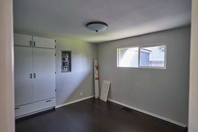 The electrical panel is now covered and the blinds are put up. - 904 S Junett