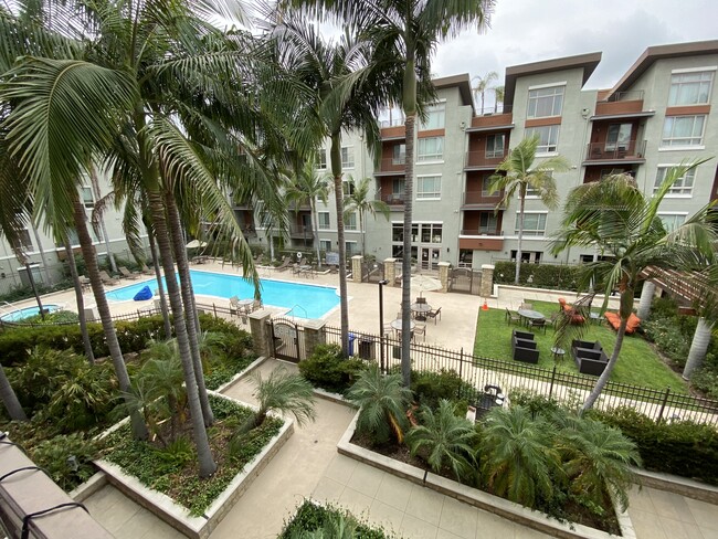 Balcony view facing courtyard and pool - 100 S Alameda St