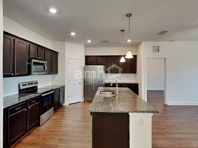 Building Photo - 6614 Hidden Rose Pl