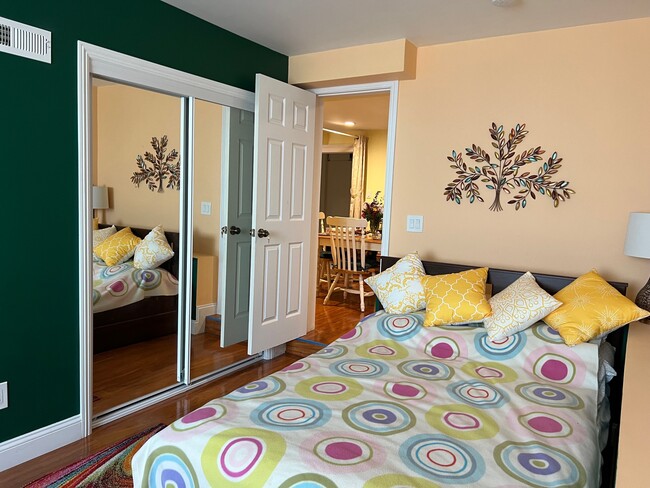 Bedroom 1 - full size bed, upholstered convertible chair-bed, desk, desk chair, large closet - 1627 15th Ave