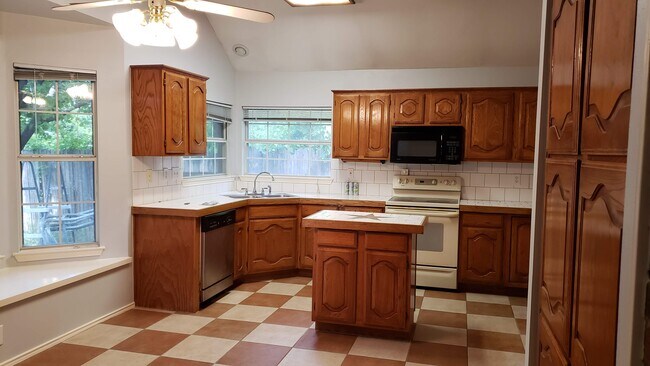 kitchen with island - 7417 Arcadia Trl