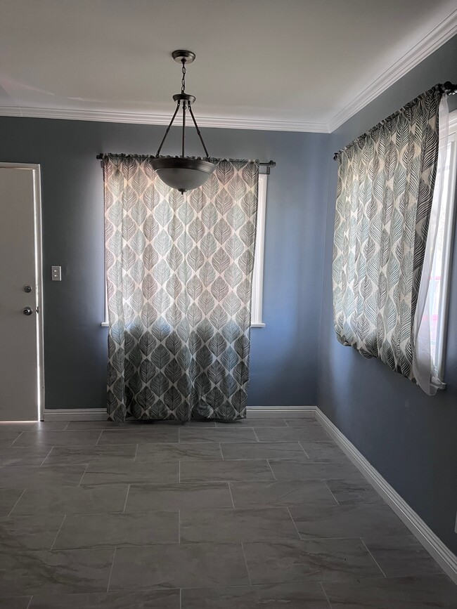 Dining area with new floor. - 11346 Califa St