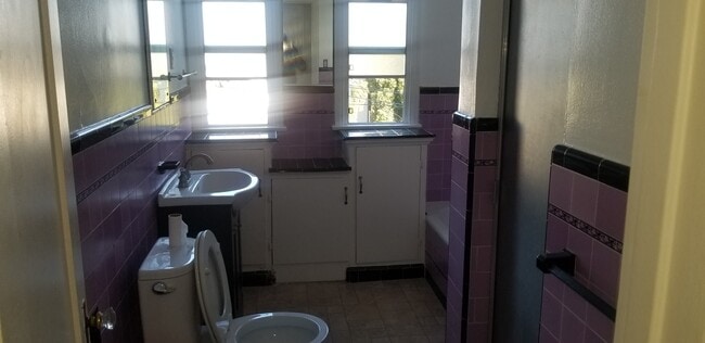 bathroom with bath and shower - 1278 S Burnside Ave