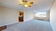 This 460 square foot apartment, located at 719 Race St in Cincinnati, OH, offers a thoughtful design that maximizes every inch of space. The single-floor layout comprises one bedroom, one bathroom, and a kitchen, creating an efficient living environment.

The primary bedroom, spanning an impressive 320 square feet, serves as a spacious retreat. It features plush carpeting, a ceiling fan for comfort, and ample closet space with sliding doors, providing both storage and style.

The bathroom showcases a clean, modern aesthetic with white tiled walls and a combination tub-shower unit. Wood-look flooring adds warmth to the space, while chrome fixtures lend a contemporary touch.

The kitchen, though compact, is well-equipped with wooden cabinetry, a stainless steel appliance suite, and a granite-look countertop. The layout optimizes functionality in the limited space, making meal preparation convenient.

The living area, while not expansive, offers flexibility for furniture arrangement. Large windows allow natural light to flood the space, creating an open and airy ambiance. The neutral color palette throughout the apartment provides a blank canvas for personal decorating styles.

This apartment combines practicality with modern comforts, making it an ideal choice for those seeking an efficient urban living space in the heart of Cincinnati.