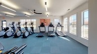Located at 2325 Nashville Pike in Gallatin, Tennessee, this single-floor fitness center offers a comprehensive workout facility designed to accommodate a wide range of exercise routines. The space is divided into several interconnected zones, each purpose-built for different training disciplines.

The cardio area is well-appointed with multiple treadmills, elliptical trainers, and a rowing machine, all positioned alongside large windows that flood the room with natural light and offer views of the surrounding outdoor environment. Ceiling fans overhead contribute to a comfortable workout atmosphere.

A dedicated strength and functional training zone features a robust multi-rack system stocked with kettlebells, medicine balls, resistance bands, TRX suspension trainers, and a punching bag. Full-length mirrors line the walls, enhancing the sense of space and allowing users to monitor their form. Wall-mounted televisions are present throughout to provide entertainment during workouts.

An open exercise area with teal-toned carpet tile flooring provides ample room for stretching, floor work, or group training. The clean, white walls and modern linear lighting fixtures give the facility a bright and professional appearance. An entry corridor with glass-paneled doors connects the zones and offers additional views of the outdoor amenity areas, including what appears to be a pool deck nearby.