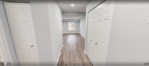 This contemporary residence at 3718 Jermantown Rd, Fairfax, VA, offers 1030 square feet of living space across two floors. The home features three bedrooms, including a spacious 170 square foot primary bedroom, and two bathrooms. The ground floor spans 490 square feet, while the upper level provides 540 square feet of space.

The interior showcases a neutral color palette with light gray walls, creating a bright and airy atmosphere throughout. Large windows in various rooms allow ample natural light to flood the space. The flooring varies, with plush carpeting in some bedrooms and sleek hardwood in other areas, adding texture and warmth to the home.

The kitchen is a highlight, boasting honey-toned wooden cabinetry, granite countertops, and stainless steel appliances. The layout is efficient, with ample storage and counter space for meal preparation. Modern recessed lighting is featured throughout the home, ensuring well-lit spaces.

Bathrooms are tastefully appointed with contemporary fixtures, including framed mirrors and stylish vanities. The living areas are versatile, offering potential for various furniture arrangements. Overall, this home presents a harmonious blend of modern design and practical living spaces, ideal for comfortable family life or entertaining guests.