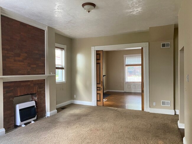 living area on first floor looking into front room - 7131 Penn Ave