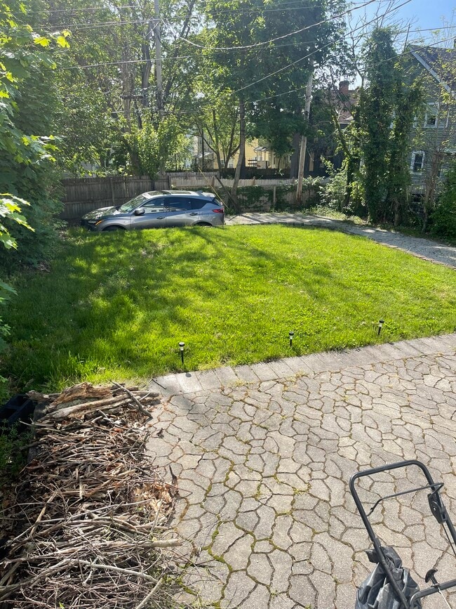 Backyard, patio, 2 parking spots with driveway - 2439 Medary Ave