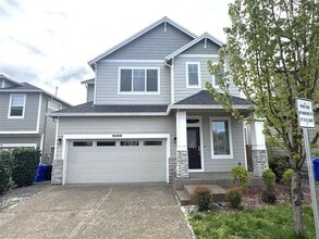 Building Photo - 6566 NE Rainsong Ln