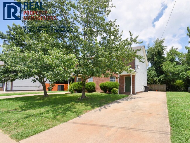 Building Photo - 2 Story Brick Duplex- Walk to MTSU! All fresh paint and flooring, washer & dryer included!