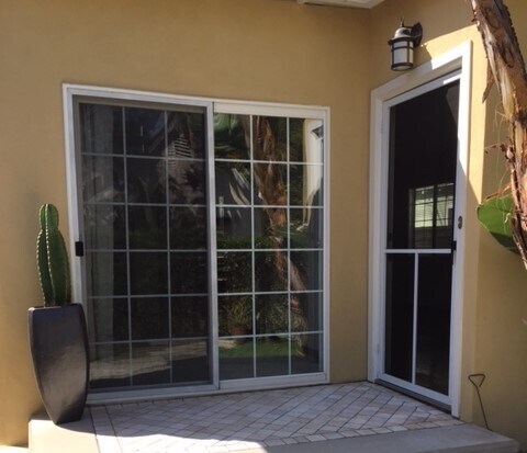 Rear of home that opens onto private patio and yard - 9052 1/2 Poinsettia Ct