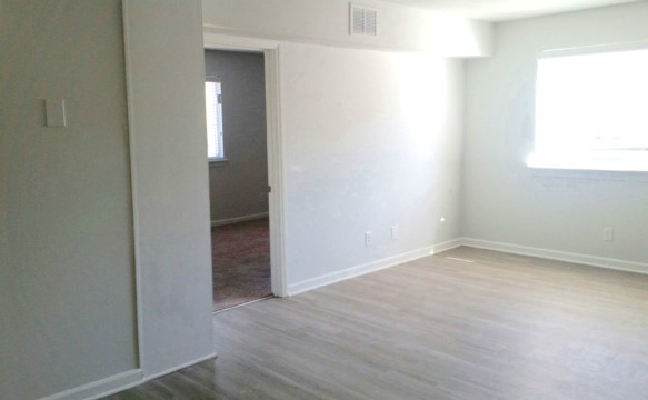 Plank flooring throughout living area. - 1806 Chapel Hill Rd