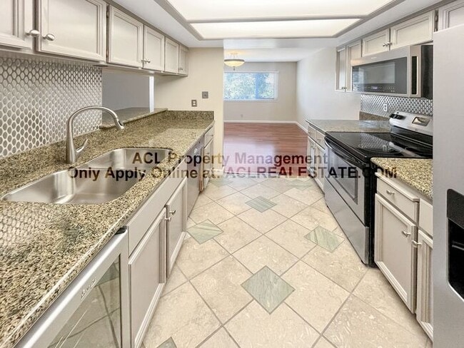 Building Photo - Bright 2BR/2BA Condo with Garage & Pool in...