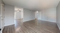 This meticulously updated 1060 square foot single-story residence in Garden Grove, CA offers a harmonious blend of modern design and practical living. The home features three bedrooms, including a spacious 150 square foot primary bedroom, and two full bathrooms. The interior showcases a fresh, neutral color palette with light gray walls and pristine white trim, creating a bright and airy ambiance throughout.

The open-concept living area boasts sleek wood-look flooring, providing a seamless flow between spaces. The kitchen has been thoughtfully renovated with crisp white cabinetry, granite countertops, and a stylish mosaic tile backsplash. Stainless steel appliances and ample storage complete this functional cooking space.

Bedrooms are generously sized, with plush carpeting for comfort and sliding closet doors for organization. The bathrooms have been updated with modern fixtures, including dual-sink vanities and glass-enclosed showers. Large windows in every room allow for plenty of natural light.

A standout feature of this property is the rooftop patio, offering a private outdoor retreat with views of the surrounding area and palm trees, perfect for relaxation or entertaining. The home's exterior maintains a clean, contemporary aesthetic with its white stucco finish.

Located at 12242 Haster St, this renovated home provides a turn-key living experience in a convenient Garden Grove neighborhood.