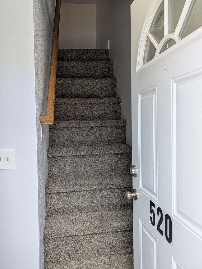 Entrance stairs to second floor, dining room to the left - 520 E Miner St