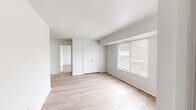 Located at 520 Featherstone Ct in Virginia Beach, VA, this single-floor, one-bedroom, one-bathroom unit offers a practical and efficient layout. The combined living and dining area serves as the heart of the home, featuring light wood-tone flooring, neutral white walls, a textured ceiling, and a closeted storage area. A window with blinds allows natural light to brighten the space and provides outdoor views of the surrounding neighborhood.

The galley-style kitchen is efficiently designed with white upper cabinetry, light wood flooring continuous from the main living area, a stainless sink, and black appliances including an electric range with overhead ventilation and a full-size refrigerator.

The bedroom is a comfortable, well-proportioned room finished with soft, neutral carpeting and a window overlooking the exterior, providing both natural light and a pleasant view. Two closets offer generous storage throughout the unit.

The bathroom features a clean, all-white tub and shower surround with chrome fixtures, maintaining the unit's consistent, bright aesthetic throughout.

Overall, this unit presents a clean, move-in-ready interior with a simple, functional design — well-suited for those seeking a straightforward, low-maintenance living space in Virginia Beach.