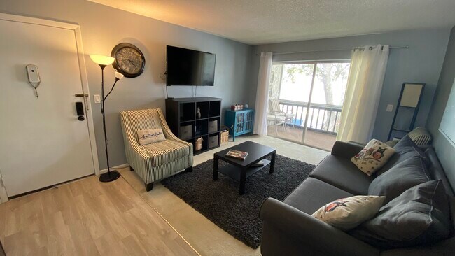 Living room with big screen TV - 3245 Beneva Rd