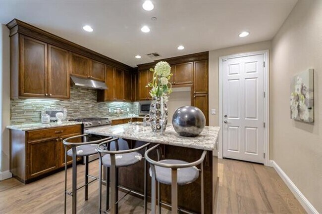 Building Photo - Impressive Two-Story, End Unit Townhome in...