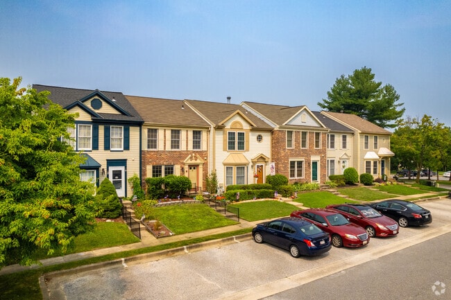 Many of the townhomes have small yards and off-street parking available for residents.