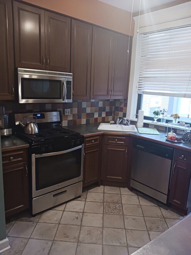 Kitchen with new gas stove - 5518 S Cornell Ave