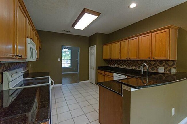 Building Photo - Elegant home with wooden floors, Ceramic tiles. Solar Panels will reduce your monthly electricity...