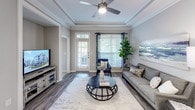 Located at 2309 Parklake Dr NE in Atlanta, Georgia, this single-floor residence offers a thoughtfully designed layout with a cohesive, modern aesthetic throughout. The living room is a standout space, featuring an elegant tray ceiling with crown molding, a ceiling fan, rich hardwood-style flooring, and large windows that invite abundant natural light. A private entry door adds convenience and connectivity to the outdoors.

The kitchen is well-equipped with white shaker cabinetry, a textured tile backsplash, stainless steel appliances including a range, microwave, refrigerator, and dishwasher, as well as a central island with white countertops — ideal for both cooking and casual dining. Light wood-tone flooring completes the clean, contemporary look.

The bedrooms are comfortably sized, each featuring plush carpeting, ceiling fans, and large windows with views of greenery outside. The rooms offer a calm, restful ambiance enhanced by neutral wall tones.

The bathrooms are finished with white vanity cabinetry, undermount sinks, large framed mirrors, and tub-shower combinations with tile surrounds featuring decorative accent borders. Wood-style flooring adds warmth to these well-lit spaces.

Overall, the residence presents a consistent, modern design language with neutral tones, quality finishes, and an emphasis on natural light and comfortable living.