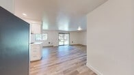 This contemporary apartment offers a spacious 1060 square feet of living area on a single floor. The layout comprises three bedrooms, including a primary bedroom of 150 square feet, two full bathrooms, and an open-concept kitchen and living area. The interior is characterized by its bright, airy ambiance, enhanced by large windows that flood the space with natural light.

The kitchen is a standout feature, boasting modern white cabinetry, sleek countertops, and stainless steel appliances. It opens seamlessly into the living area, creating an ideal space for entertaining. The addition of a kitchen island adds both functionality and visual appeal.

Throughout the apartment, warm-toned hardwood flooring creates a cohesive and inviting atmosphere. The bedrooms are generously sized, with the primary bedroom offering ample space at 150 square feet. Each room features crisp white walls and recessed lighting, providing a blank canvas for personalization.

The bathrooms are tastefully appointed with white fixtures and vanities, complemented by large mirrors and modern lighting. The apartment also includes the convenience of an in-unit laundry room, complete with a full-sized washer and dryer.

Located at 9301 SW Sagert St in Tualatin, Oregon, this apartment combines modern design with practical living, offering a comfortable and stylish home in a desirable location.