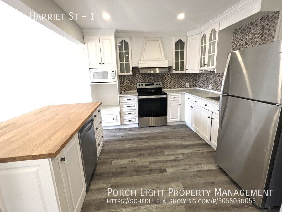 Primary Photo - BEAUTIFUL 2 Bedroom Main floor with parking and private laundry