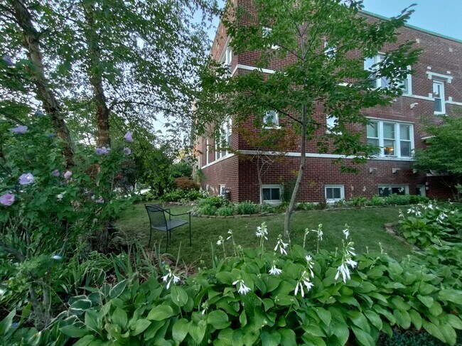 The building is on a corner lot in a quiet neighborhood. - 1407 Monroe St