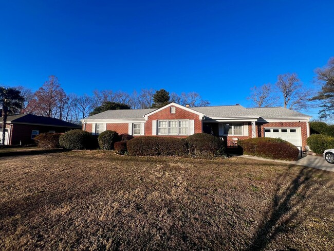 Building Photo - Lovely mid-sentry brick ranch on a beautif...