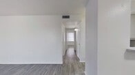 This 650 square foot apartment in Dallas, Texas, offers a well-designed living space with two bedrooms and one bathroom. The unit features a modern aesthetic with crisp white walls and sleek gray wood-look flooring throughout, creating a cohesive and contemporary ambiance. The primary bedroom, measuring 130 square feet, provides ample space for comfortable living.

The apartment's layout maximizes functionality, with a living room that benefits from natural light through a large window. Both bedrooms are equipped with closets for storage, and the bathroom showcases clean, white tiling and a full-sized bathtub with shower. The property's single-floor design ensures easy accessibility and flow between rooms.

Windows in various rooms allow for natural illumination, enhancing the sense of openness in the space. The neutral color palette and minimalist design create a blank canvas for personal styling. Located at 3800 S Tyler St in Dallas, this apartment offers a blend of modern comfort and practical living in a compact urban setting.