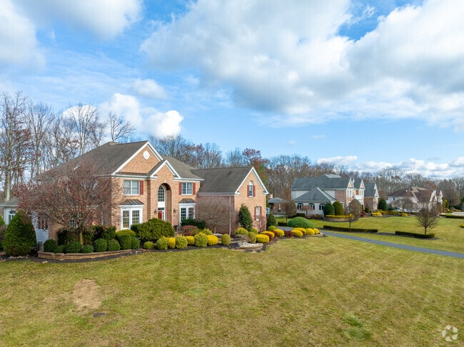 Rows of large homes with driveways and garages can be found in East Freehold.