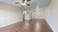 This 840 square foot single-story home in Franklin, TN offers a practical layout with two bedrooms and one bathroom. The property features a blend of flooring types, with plush carpeting in the bedrooms and sleek hardwood in the main living areas. The open-concept design combines the living room and kitchen, creating a spacious feel despite the compact footprint.

Large windows in the bedrooms and living area flood the space with natural light, complementing the neutral color palette of the walls. Ceiling fans throughout provide both illumination and air circulation. The primary bedroom, measuring 170 square feet, offers ample space and includes a closet with sliding doors.

The kitchen, while compact, appears functional with modern appliances and cabinetry. The bathroom features standard amenities including a bathtub-shower combination with tiled surroundings. The home's layout is efficiently designed, maximizing the use of available space.

Overall, this property presents a cozy and practical living space, ideal for small families or individuals seeking a low-maintenance home in a suburban setting. The neutral decor and well-maintained appearance provide a blank canvas for personal touches and decorating preferences.