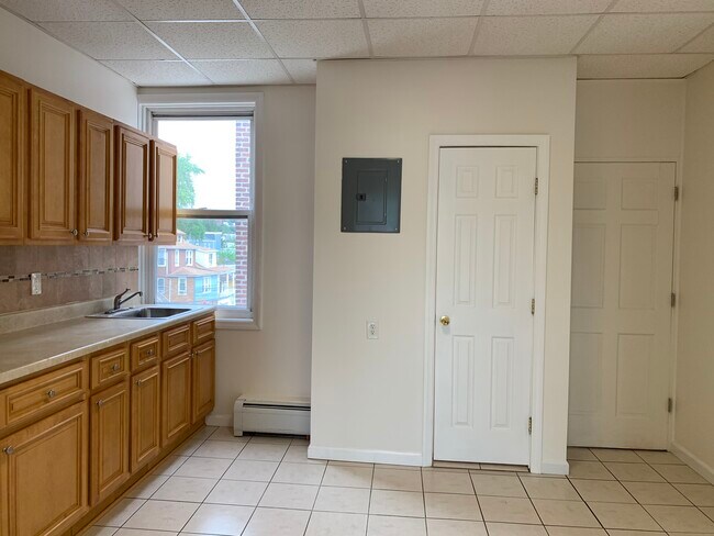bathroom door and entry door to the apartment - 1453 48TH St