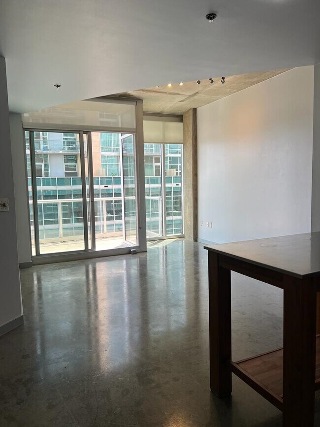 View of Floor to Ceiling windows in living room - 600 12th Ave S