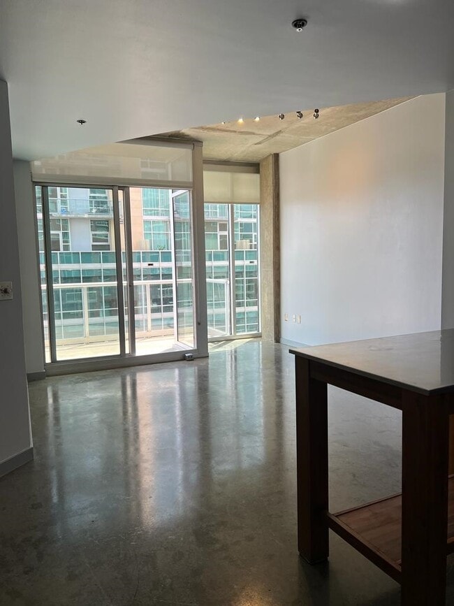 View of Floor to Ceiling windows in living room - 600 12th Ave S
