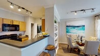 This 1-bedroom, 1-bathroom residence in Magnolia, TX offers a thoughtfully designed single-floor layout that maximizes functionality and comfort. The kitchen features warm maple cabinetry, dark countertops, stainless steel appliances including a full-size refrigerator, and a breakfast bar with seating — all illuminated by track lighting and accented with crown molding. The kitchen opens seamlessly to a dedicated dining area with hardwood-style flooring, built-in shelving, and a sliding door that invites natural light. The living room is bright and welcoming, with crown molding, a ceiling fan, large windows with blinds, and hardwood-style floors that carry throughout the main living areas. The bedroom is carpeted for comfort and features a ceiling fan, a large window, and direct access to a walk-in closet. The full bathroom includes a tiled tub-shower combination. A dedicated utility area houses a stacked washer and dryer alongside a water heater, adding everyday convenience. Throughout the unit, neutral tones, crown molding, and consistent finishes contribute to a cohesive and polished aesthetic.