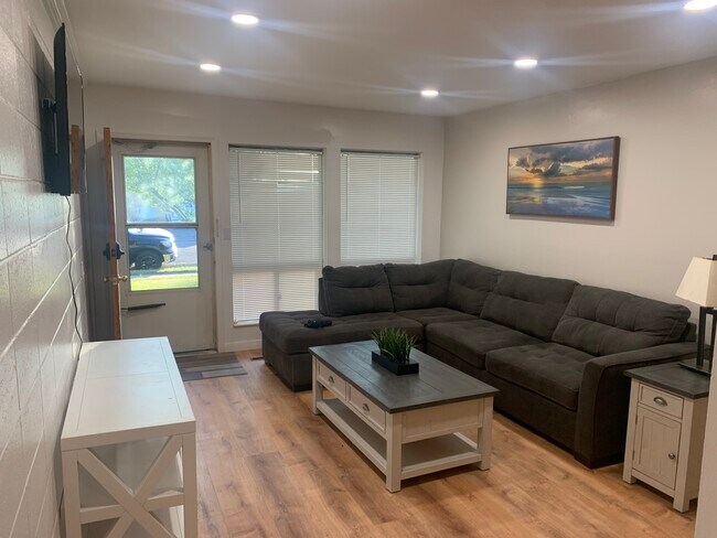 Living room includes couch, television, console, coffee table, intable - 896 Raymond Dr