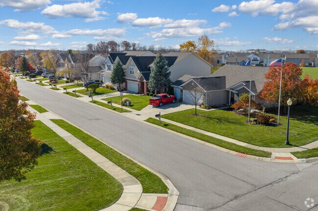 Rows of charming homes line quaint, tree-lined streets in Whitestown.