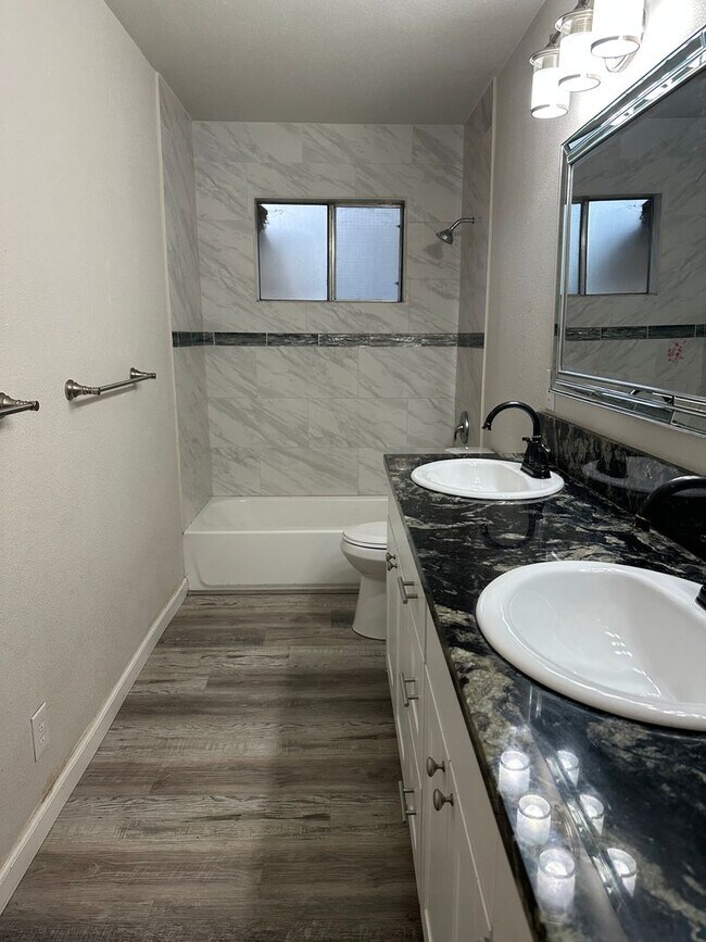 Building Photo - 3 BEDROOM 2 BATHROOM WITH A POOL