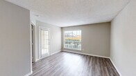 Located at 6315 Central City Blvd in Galveston, TX, this one-bedroom, one-bathroom unit offers a well-organized single-floor layout designed for comfortable everyday living. The open-concept living room and kitchen area form the heart of the space, with durable wood-look laminate flooring and neutral-toned walls creating a clean, cohesive aesthetic throughout. A glass-paneled front door and multiple windows fitted with blinds allow natural light to fill the living area, enhancing its bright and airy feel.

The kitchen is thoughtfully appointed with warm-toned cabinetry, granite-style countertops, a tiled backsplash, and a peninsula that provides additional counter space and separation from the living area. A full suite of black and stainless steel appliances, including a range, microwave, dishwasher, and refrigerator, complete the kitchen.

The bedroom offers a comfortable footprint, accented by a ceiling fan with light fixture and a window that continues the natural light theme. A closet provides dedicated storage. The bathroom features tile flooring, a granite-topped vanity with wood cabinetry, and a full tub/shower combination with tile surround. Textured ceilings are consistent throughout the unit.