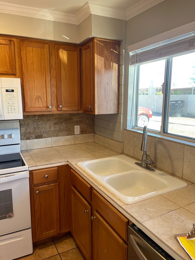 Lots of natural light in kitchen - Lantana Village Apartments