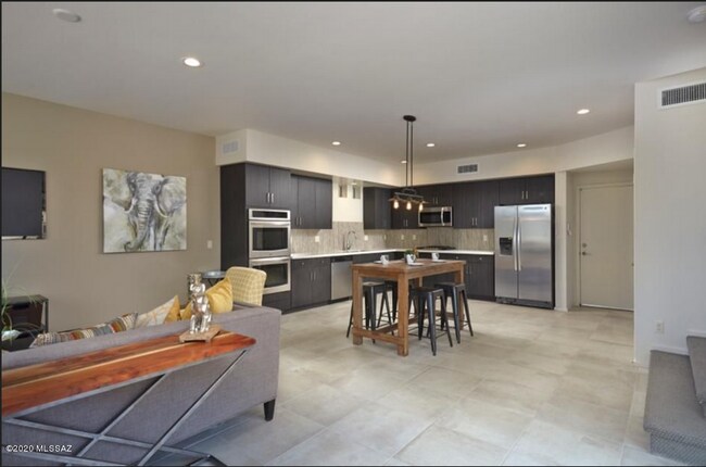 Model picture - Rental house has LVP flooring downstairs - 8682 E Avant Garde Way