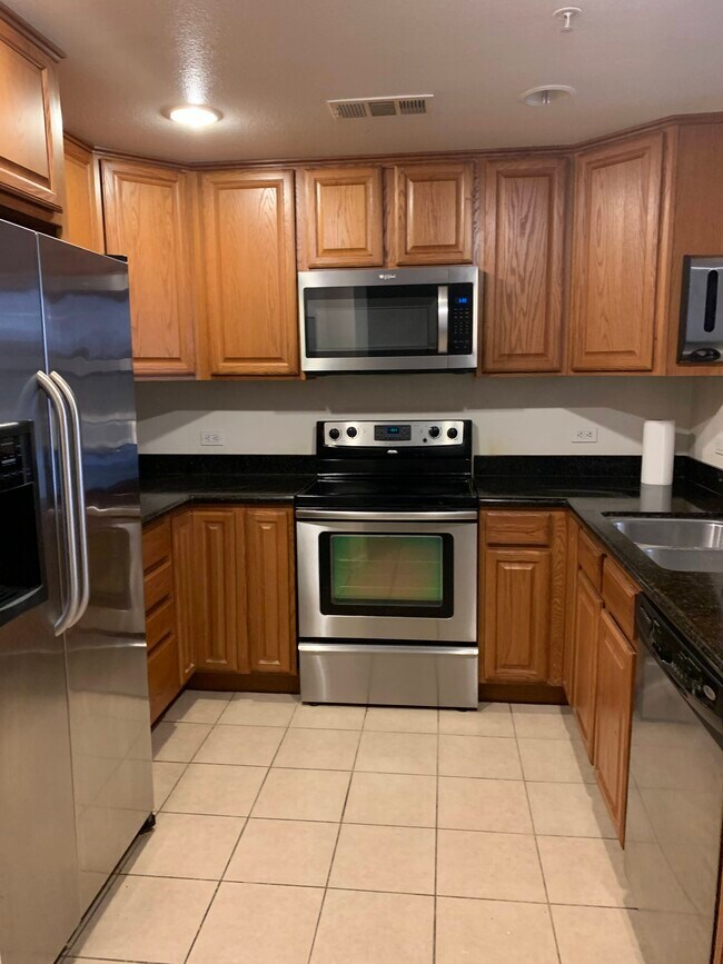Spacious kitchen with stainless steel appliances - 800 S Abel St