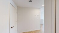 Located in the southwest corner of Calgary, this well-appointed 2-bedroom, 2-bathroom unit offers a clean, modern aesthetic across a thoughtfully designed single-level layout. The open-concept kitchen and living area serves as the heart of the home, anchored by a large central island with a double undermount sink and sleek white quartz countertops. Floor-to-ceiling white cabinetry provides generous storage, while stainless steel appliances — including a refrigerator, range, and over-the-range microwave — add a polished, contemporary finish. Pendant lighting above the island and recessed ceiling lights brighten the space throughout. Light wood laminate flooring flows consistently across the living areas and bedrooms, creating a warm and cohesive feel. The two bedrooms are bright and airy, each featuring large windows that frame open outdoor views of the surrounding Calgary skyline and neighbourhood. Baseboard heating runs along the perimeter of the bedrooms. The primary bathroom includes a full tub-shower combination, a white vanity with a single sink, and tile flooring, while the second bathroom offers a compact yet functional layout with a vanity and toilet. A private balcony extends the living space outdoors. A dedicated closet and hallway round out the practical layout of this well-lit, move-in-ready unit.