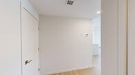 Located in the southwest corner of Calgary, this well-appointed 2-bedroom, 2-bathroom unit offers a clean, modern aesthetic across a thoughtfully designed single-level layout. The open-concept kitchen and living area serves as the heart of the home, anchored by a large central island with a double undermount sink and sleek white quartz countertops. Floor-to-ceiling white cabinetry provides generous storage, while stainless steel appliances — including a refrigerator, range, and over-the-range microwave — add a polished, contemporary finish. Pendant lighting above the island and recessed ceiling lights brighten the space throughout. Light wood laminate flooring flows consistently across the living areas and bedrooms, creating a warm and cohesive feel. The two bedrooms are bright and airy, each featuring large windows that frame open outdoor views of the surrounding Calgary skyline and neighbourhood. Baseboard heating runs along the perimeter of the bedrooms. The primary bathroom includes a full tub-shower combination, a white vanity with a single sink, and tile flooring, while the second bathroom offers a compact yet functional layout with a vanity and toilet. A private balcony extends the living space outdoors. A dedicated closet and hallway round out the practical layout of this well-lit, move-in-ready unit.