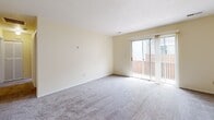 Located at 441–449 Graham Rd in Cuyahoga Falls, Ohio, this single-floor unit offers three bedrooms, one bathroom, a kitchen, a utility room, and a hallway — all laid out in a compact yet functional floor plan. The bedrooms feature neutral cream-toned walls and plush carpeting, creating a comfortable and quiet atmosphere. The primary bedroom is notably spacious, providing ample room for furnishings. Additional bedrooms offer practical sizing suitable for sleeping quarters, a home office, or guest accommodations. The kitchen is equipped with warm oak cabinetry, a double-basin sink, light countertops, a gas range with overhead ventilation, and easy-to-maintain tile flooring — delivering a straightforward and efficient cooking space. The full bathroom includes a vanity with white cabinetry, a framed mirror, a tub/shower combination, and tile flooring. The living area benefits from natural light and features sliding glass doors that open to an outdoor space, adding a bright, airy quality to the room. Throughout the unit, cream-colored walls and clean white trim contribute to a consistent, neutral aesthetic. A dedicated utility room adds practical storage and functional convenience to this well-organized home.