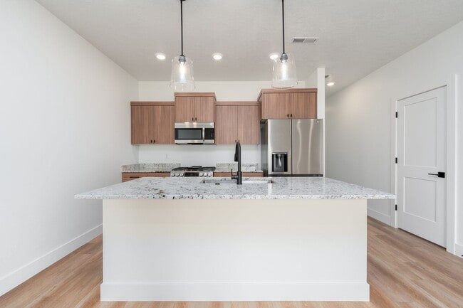 Building Photo - Super cute Row Home with 1 car garage 2 be...